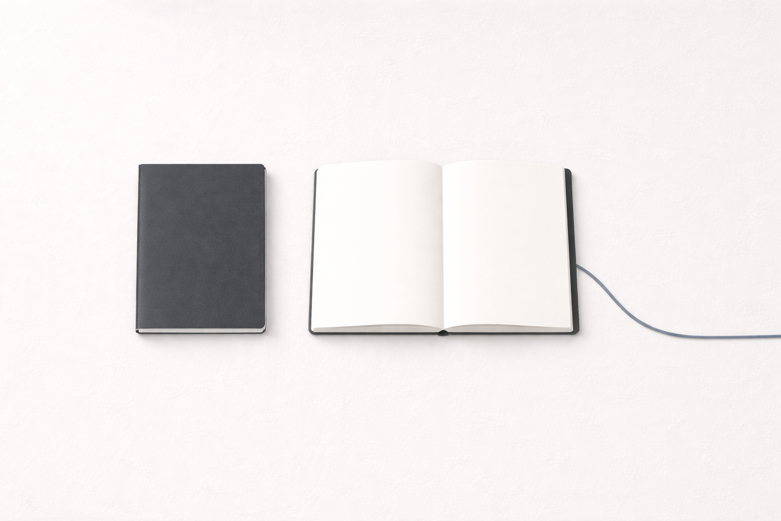 Minimalist notebooks on a gray desk
