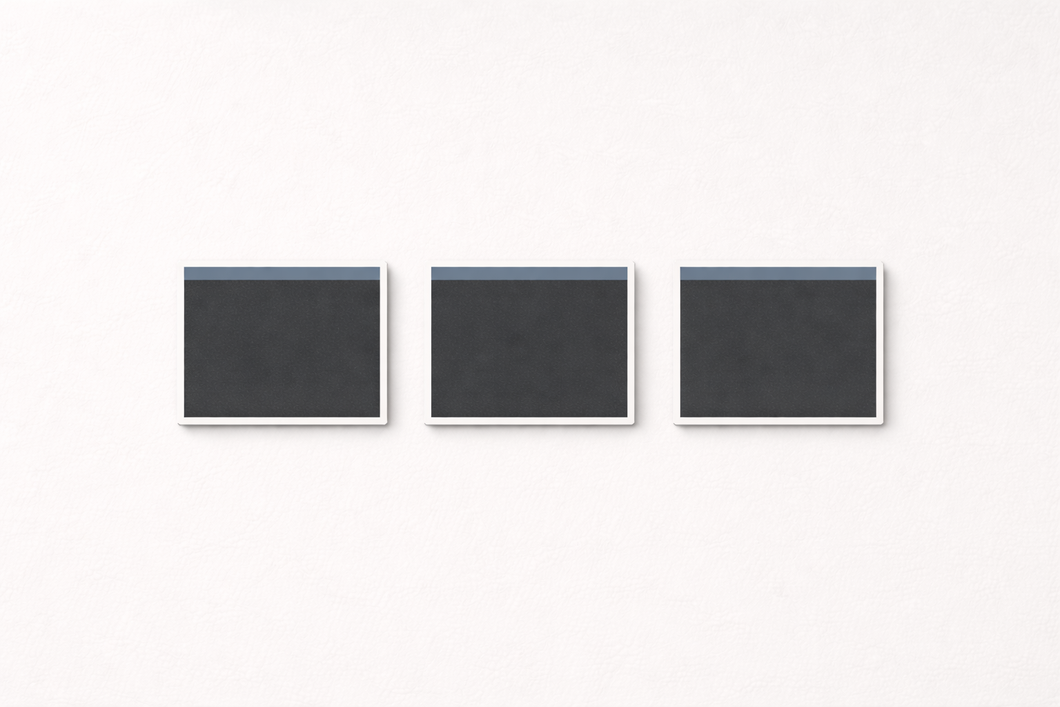 Three identical cards on gray background